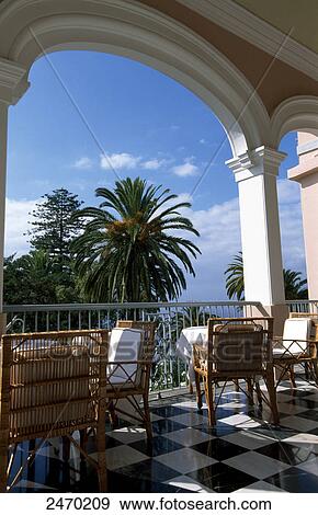 Chairs in hotel balcony, Reid's Palace Hotel, Funchal, Madeira, Portugal View Large Photo Image Stock Photo - Chairs in hotel balcony, Reid's Palace Hotel, Funchal, Madeira, Portugal . Fotosearch