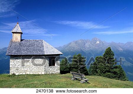 Chapel in field with mountain range in background, Hohe Tauern, Alps, Moelltal, Carinthia, Austria View Large Photo Image Stock Photo - Chapel in field with mountain range in background, Hohe Tauern, Alps, Moelltal, Carinthia, Austria . Fotosearch