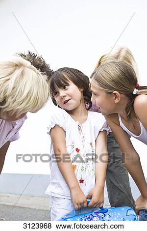 Stock Photo - Children listening to a little girl . Fotosearch
