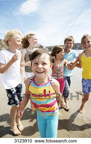 Stock Image - Children on the beach . Fotosearch