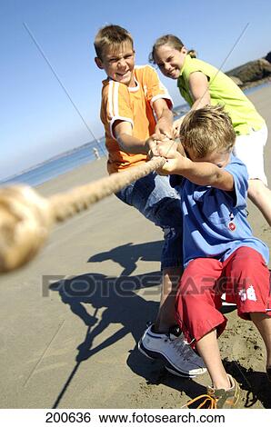 Children playing tug of war View Large Photo Image Stock Photograph - Children playing tug of war . Fotosearch