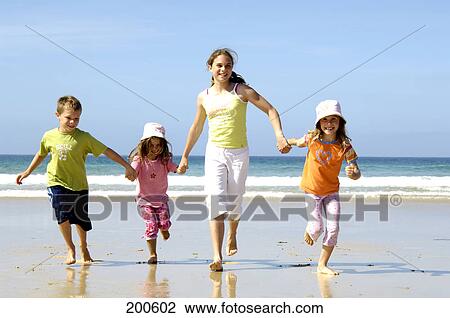 Children running at beach View Large Photo Image Stock Image - Children running at beach . Fotosearch