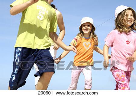 Stock Image - Children running, elevated view . Fotosearch