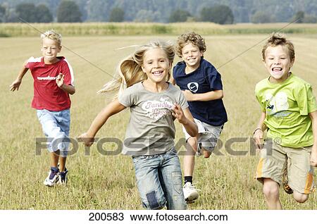 Stock Image - Children running over field . Fotosearch