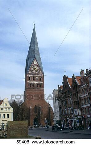 Clock tower against blue sky, St. John's Church, Lunenburg, Lower Saxony, Germany View Large Photo Image Stock Photo - Clock tower against blue sky, St. John's Church, Lunenburg, Lower Saxony, Germany . Fotosearch