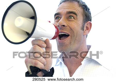 Stock Photography - Close-up of a mature man shouting into a megaphone . Fotosearch