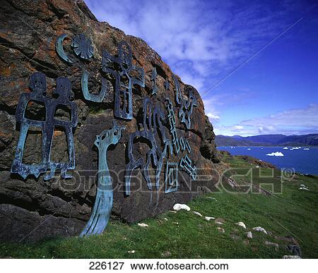 Close-up of ancient designs cutouts on rock at coast View Large Photo Image Stock Photo - Close-up of ancient designs cutouts on rock at coast . Fotosearch