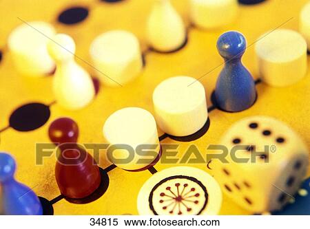 Stock Photography - Close-up of board game pieces and dice . Fotosearch