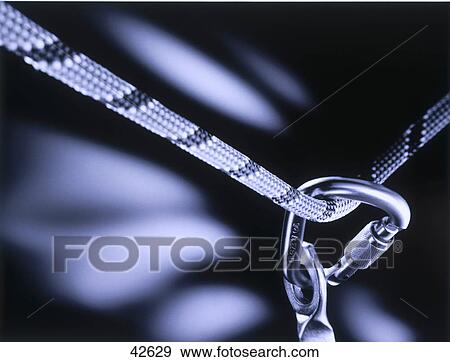 Close-up of carabiner and rope View Large Photo Image Stock Photo - Close-up of carabiner and rope . Fotosearch