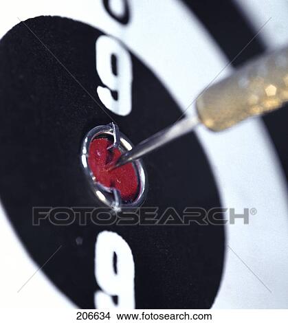 Close-up of dart on bull's eye on dart board View Large Photo Image Picture - Close-up of dart on bull's eye on dart board . Fotosearch