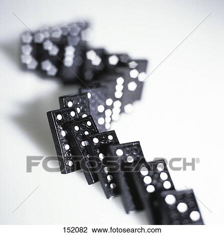 Close-up of falling row of dominoes View Large Photo Image Stock Image - Close-up of falling row of dominoes . Fotosearch