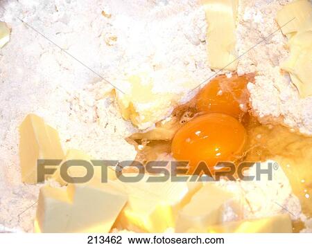 Close-up of flour, egg yolk and butter View Large Photo Image Stock Image - Close-up of flour, egg yolk and butter . Fotosearch