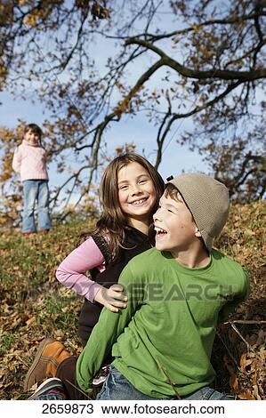 Close-up of girl and boy smiling View Large Photo Image Stock Image - Close-up of girl and boy smiling . Fotosearch