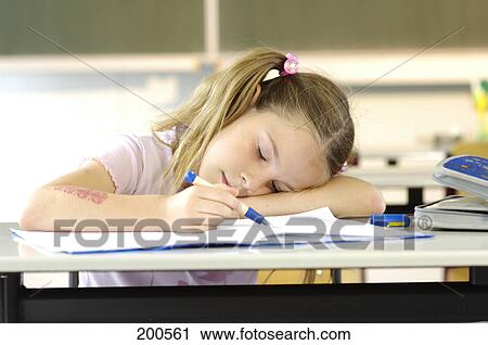 Close-up of girl sleeping in classroom View Large Photo Image Stock Image - Close-up of girl sleeping in classroom . Fotosearch