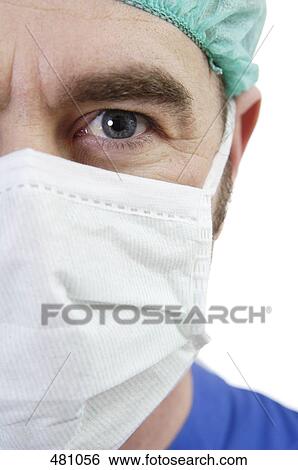 Stock Photograph - Close-up of male surgeon wearing mask . Fotosearch