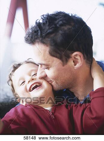 Close-up of man playing with his son View Large Photo Image Stock Photo - Close-up of man playing with his son . Fotosearch