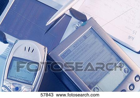 Stock Image - Close-up of personal data assistant and mobile phone . Fotosearch
