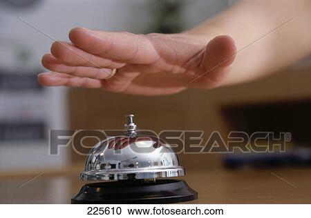 Close-up of person's hand ringing bell View Large Photo Image Stock Image - Close-up of person's hand ringing bell . Fotosearch