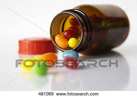 Close-up of pills and bottle View Large Photo Image Stock Photo - Close-up of pills and bottle . Fotosearch