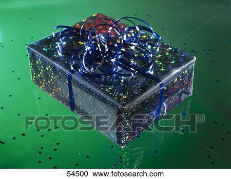 Close-up of present wrapped with wrapping paper View Large Photo Image Stock Image - Close-up of present wrapped with wrapping paper . Fotosearch