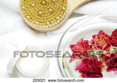 Stock Image - Close-up of roses and water in bowl . Fotosearch