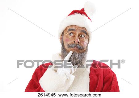 Stock Photography - Close-up of senior man in santa costume thinking . Fotosearch