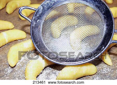 Close-up of sieve and biscuits with icing sugar View Large Photo Image Stock Image - Close-up of sieve and biscuits with icing sugar . Fotosearch