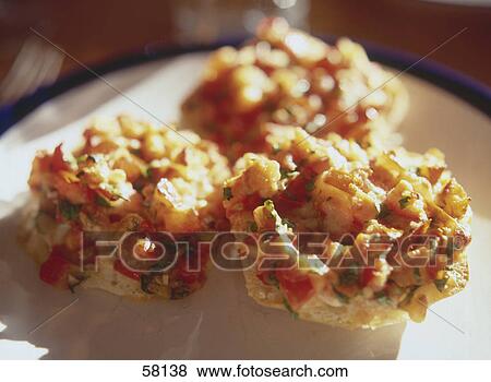 Close-up of slices of pizza on plate View Large Photo Image Stock Photo - Close-up of slices of pizza on plate . Fotosearch