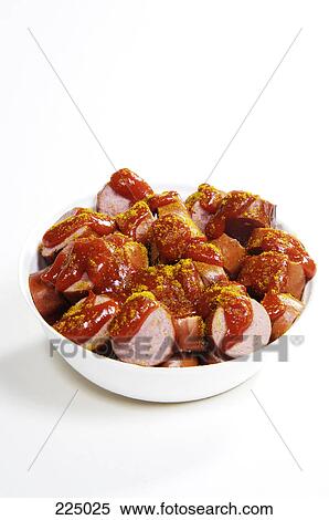 Close-up of slices of sausages and ketchup in bowl View Large Photo Image Stock Photography - Close-up of slices of sausages and ketchup in bowl . Fotosearch