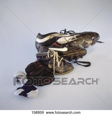 Close-up of sock and shoes in row View Large Photo Image Stock Photo - Close-up of sock and shoes in row . Fotosearch