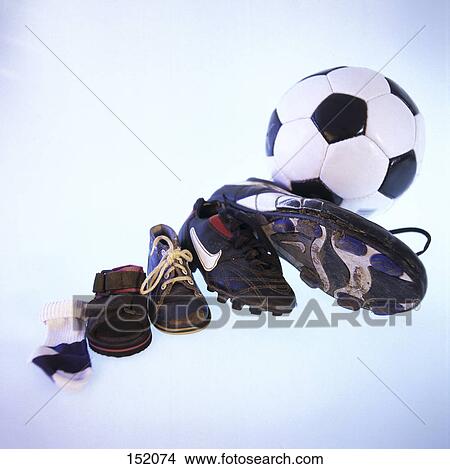Close-up of sock and shoes in row with soccer ball View Large Photo Image Picture - Close-up of sock and shoes in row with soccer ball . Fotosearch