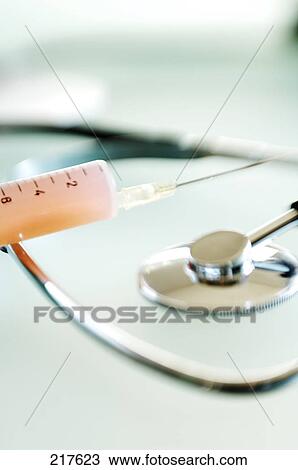 Close-up of stethoscope and syringe View Large Photo Image Stock Image - Close-up of stethoscope and syringe . Fotosearch