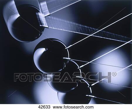 Close-up of swinging pendulums View Large Photo Image Stock Image - Close-up of swinging pendulums . Fotosearch