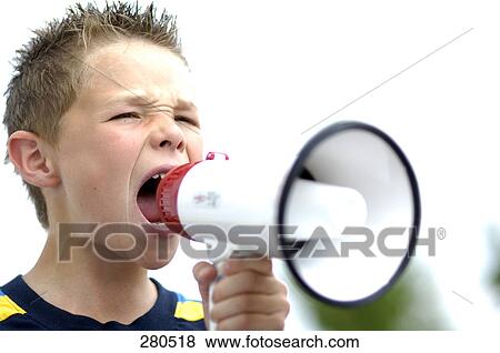 Stock Photo - Close-up of teenage boy using megaphone . Fotosearch