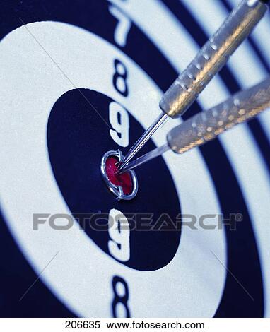 Stock Photography - Close-up of two darts on bull's eye on dart board . Fotosearch