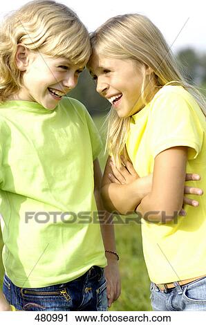 Close-up of two girls smiling View Large Photo Image Stock Image - Close-up of two girls smiling . Fotosearch