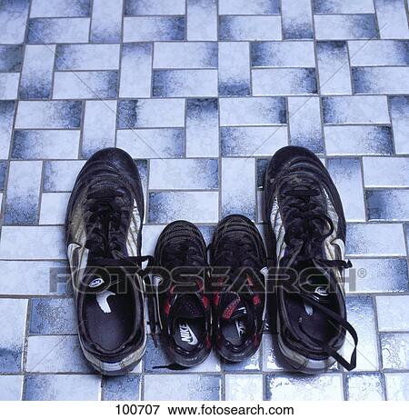 Stock Photo - Close-up of two pairs of soccer shoes . Fotosearch