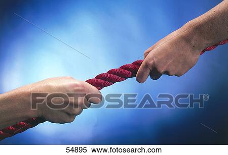 Close-up of woman in tug-of-war with man View Large Photo Image Stock Photography - Close-up of woman in tug-of-war with man . Fotosearch
