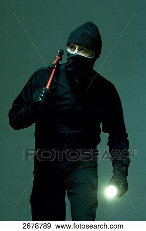 Stock Photo - criminal person planning a robbery, portrait . Fotosearch