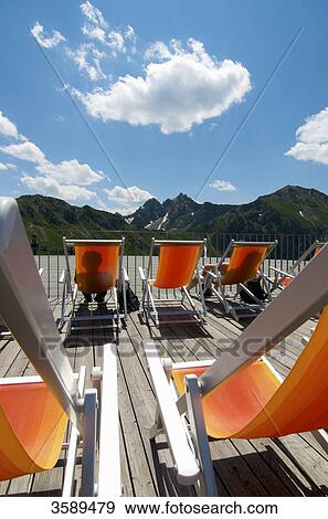 Stock Photo - Deck chairs on Kanzelwand, Kleinwalsertal, Vorarlberg, Austria, Europe . Fotosearch