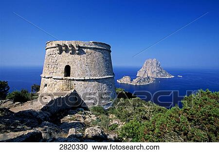 Defence tower at coast, Es Vedra, Ibiza, Balearic Islands, Spain View Large Photo Image Stock Image - Defence tower at coast, Es Vedra, Ibiza, Balearic Islands, Spain . Fotosearch
