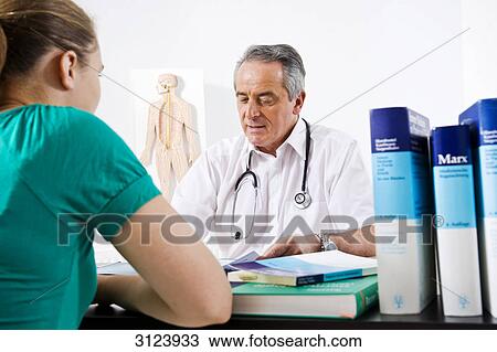 Stock Image - Doctor and female patient . Fotosearch