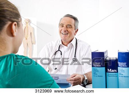Doctor and female patient View Large Photo Image Stock Photo - Doctor and female patient . Fotosearch