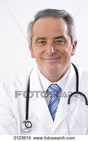 Doctor smiling at the camera, portrait, close-up View Large Photo Image Stock Photo - Doctor smiling at the camera, portrait, close-up . Fotosearch