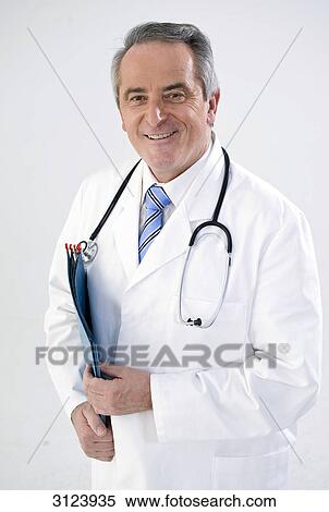Doctor smiling at the camera, portrait View Large Photo Image Stock Photography - Doctor smiling at the camera, portrait . Fotosearch