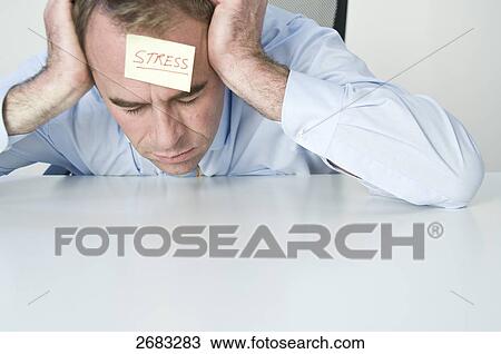 exhausted businessman resting on his table View Large Photo Image Stock Image - exhausted businessman resting on his table . Fotosearch