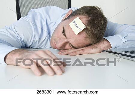 exhausted businessman resting on his table View Large Photo Image Stock Image - exhausted businessman resting on his table . Fotosearch