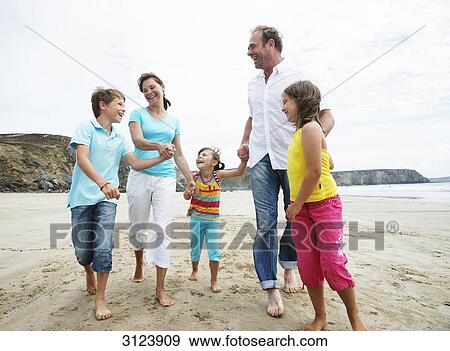 Family on the beach View Large Photo Image Stock Photo - Family on the beach . Fotosearch
