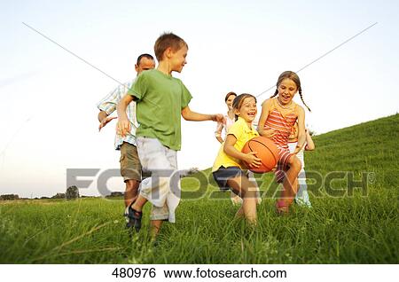 Family playing basketball in field View Large Photo Image Stock Photograph - Family playing basketball in field . Fotosearch
