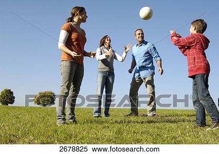 Family playing volleyball View Large Photo Image Stock Photography - Family playing volleyball . Fotosearch